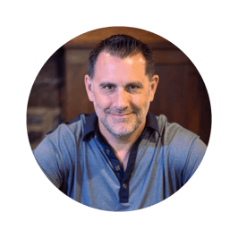 Founder and CEO of SaaS Talent, Michael Bertoni, sitting in a chair and looking directly at the camera. Best recruiting firm and talent acquistion expert for saas and tech companies hires talent in the us and latin america.